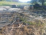 a pile of wood sitting in the middle of a field