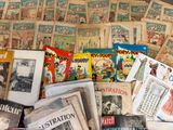 a pile of old books and magazines on the floor