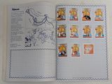 an open book with a picture of animals and stamps on it