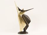 an abstract bronze sculpture of a man with a hat on his head