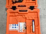 three orange tool cases are lined up on the floor next to each other