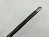 a close up of a golf club handle on a white surface