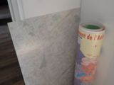 a picture of a toilet paper roll leaning against a wall
