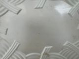 a close up of a white vase with a pattern on it