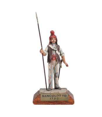 figurine of a man with a spear and a hat