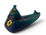 a small blue boat with a yellow flower on it