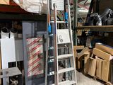 a ladder that is leaning against a wall in a warehouse