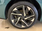 a close up of a car ' s wheel on the ground