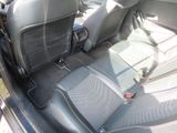 a car that has two seats in the back of it