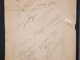 an old piece of paper with writing on it sitting on a table