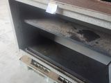 an old oven that is sitting in the middle of the floor