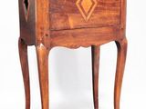 a small wooden table with a drawer on top of it