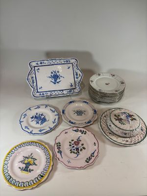 a lot of plates that are sitting on a table