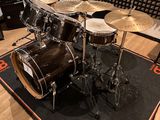 a close up of a drum set on a rug in a room