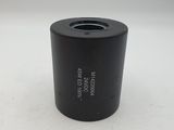a close up of a small black object on a white surface