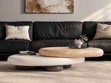 a black leather couch and a coffee table in a living room