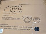 packaging of a pair of vases in a cardboard box on the floor