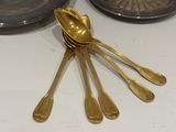 a lot of spoons that are sitting on a table