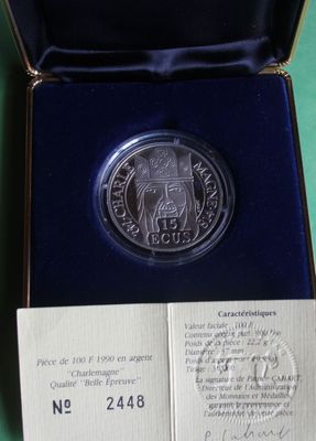 an image of a silver coin in a black box