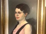 a painting of a woman in a pink dress in a gold frame