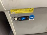 an image of a machine with a clock on it