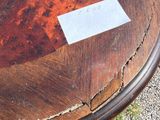 a wooden table with a piece of paper on top of it
