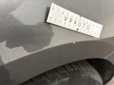 a close up of a sticker on a car ' s bumper