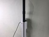 an image of a black and white vacuumr sitting on top of a counter