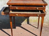 an old wooden desk with two drawers and a drawer underneath it