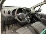 the interior of a small car with a steering wheel and dashboard