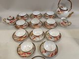 a lot of cups and saucers on the table