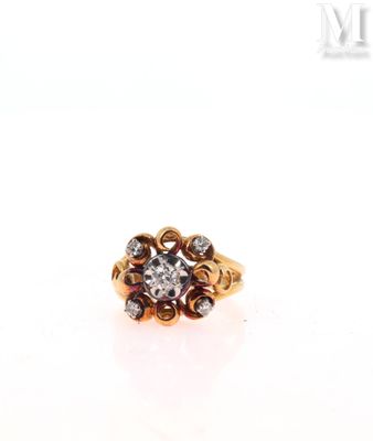a close up of a gold ring with a diamond center