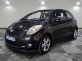 a picture of a black toyota yaris parked on a checkered floor