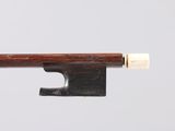 a close up of a violin bow on a white background