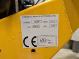 a close up of a sign on a yellow machine
