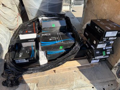 many boxes of electronic equipment sitting on a pallet