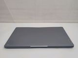 a laptop that is sitting on a white table