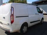 a white van that is parked in a parking lot