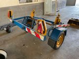 an image of a vehicle being worked on in a garage