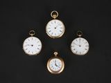 three different types of pocket watches on a black surface