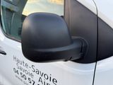 a side view mirror of a white van with a logo on it