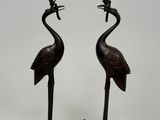 pair of bronze candlesticks with birds and flowers on them
