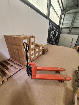 a pallet that is sitting on the floor next to some boxes