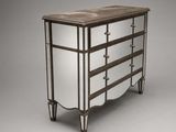 a metal and mirrored chest of drawers with four drawers