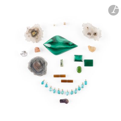 a close up of a group of jewelry on a white surface