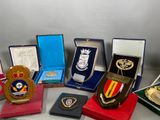 a lot of medals and medals on display on a table