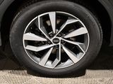 a close up view of a car ' s wheel on the ground