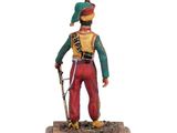 figurine of a soldier with a sword and hat on a wooden base