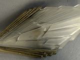 a close up of a metal object on a white surface