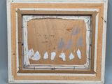 an old picture frame with a drawing of a man and a woman on it